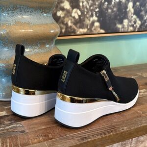 DKNY Black and Gold Slip-On Platform Sneakers like new condition